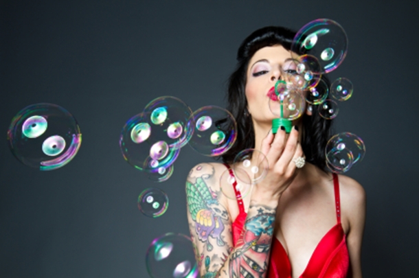 Sexy Woman Blowing Bubbles