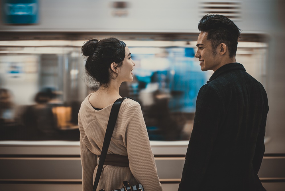 Couple Standing in front of Subway