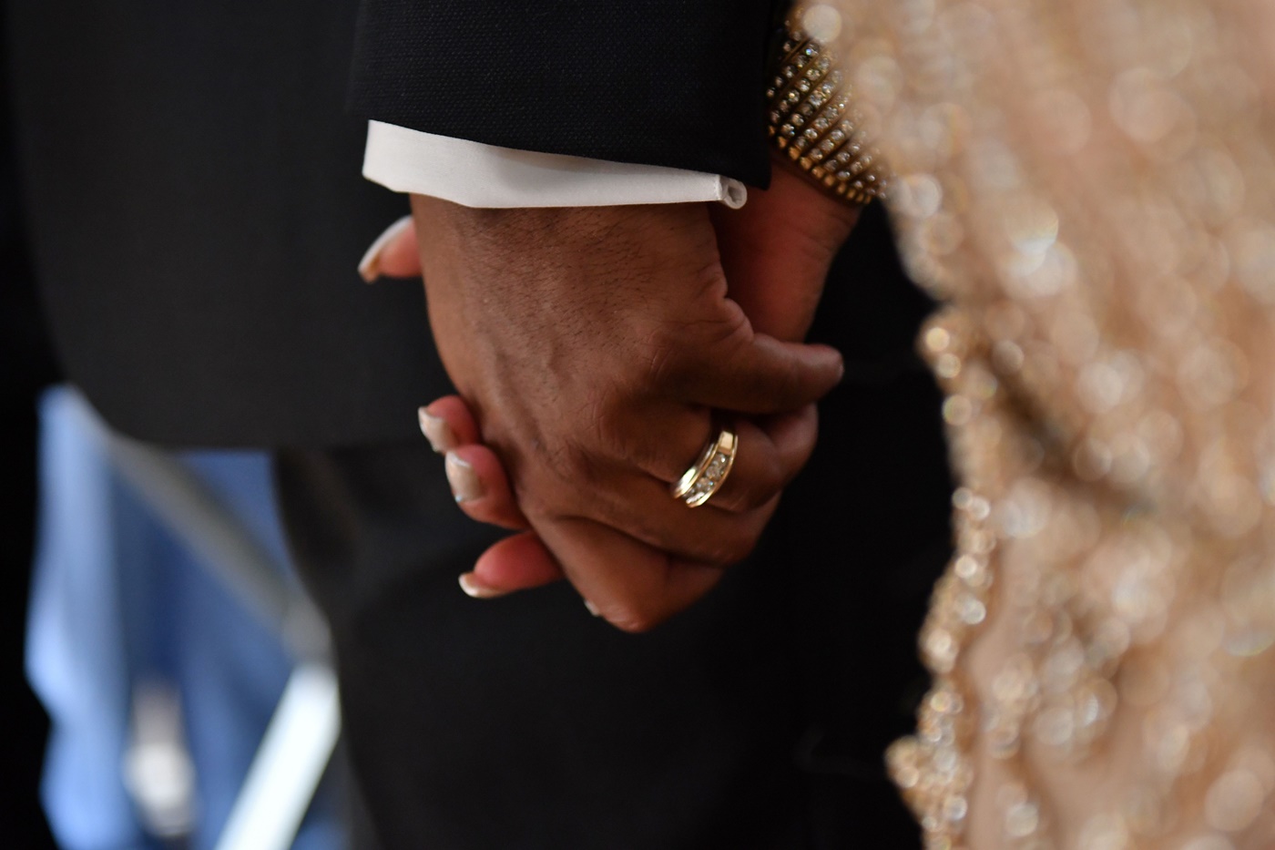 Couple's Hands with Wedding Bands