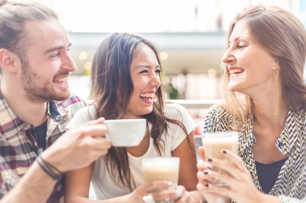 triad in a relationship alternative to monogamy enjoying coffee together 