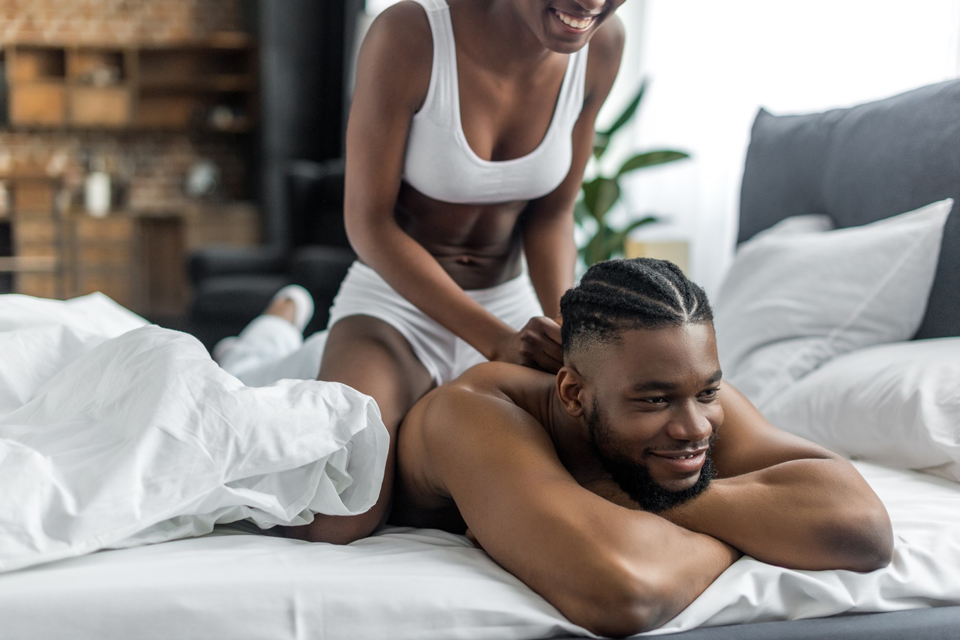 Woman Massaging Partner