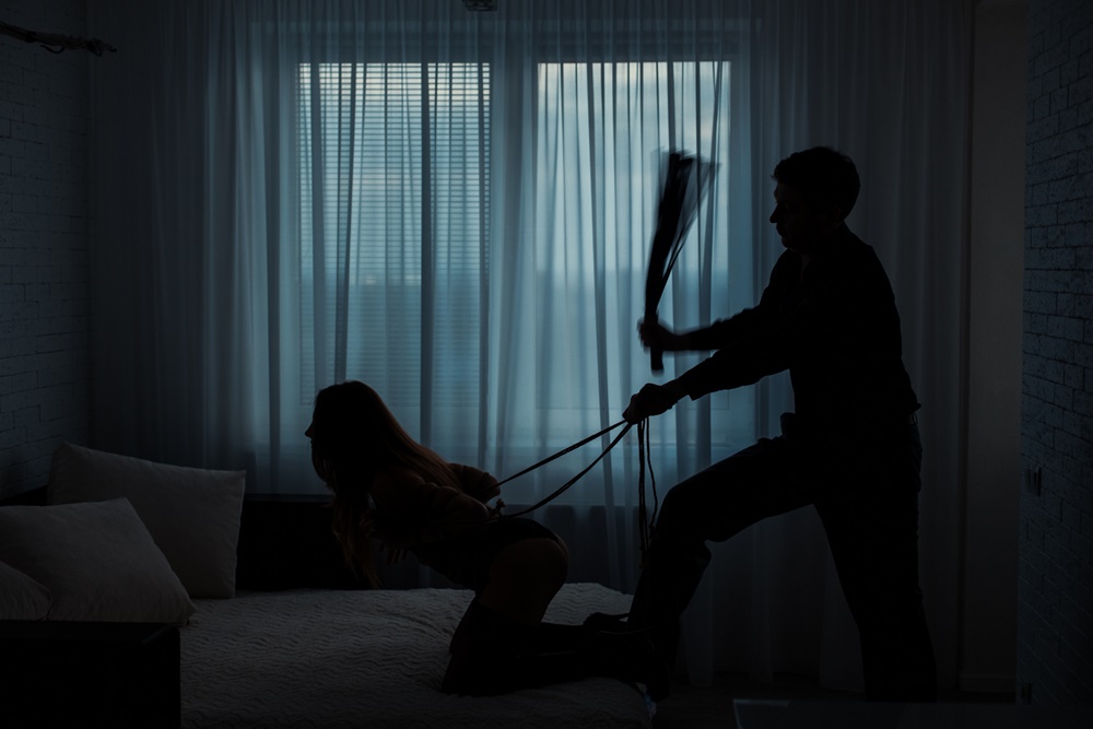 Man Flogging Woman
