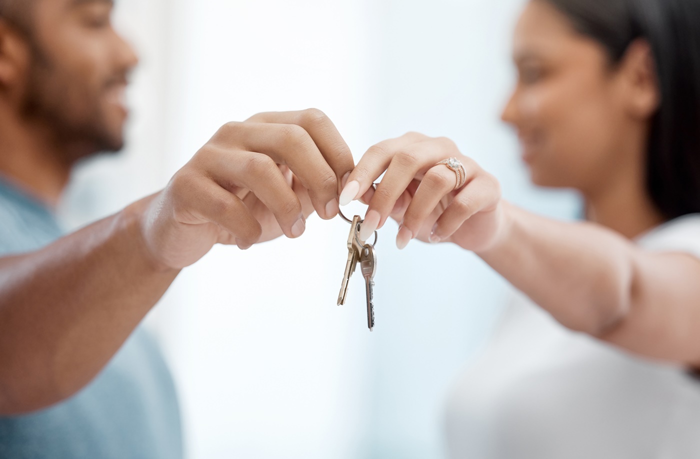 Couple Holding Set of Keys Together
